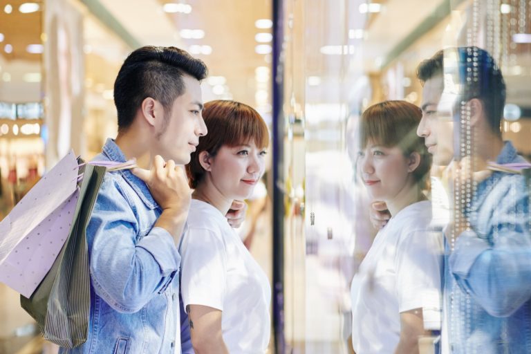 Couple Looking At Shop Display