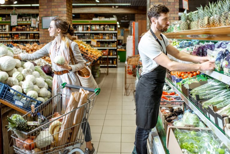 Woman and worker in the supermarket