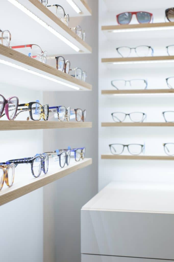 glasses on a shelf in a store